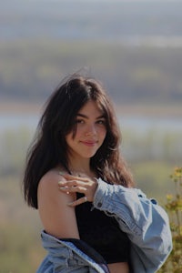 a woman wearing a denim jacket