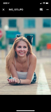 a photo of a woman laying on the ground